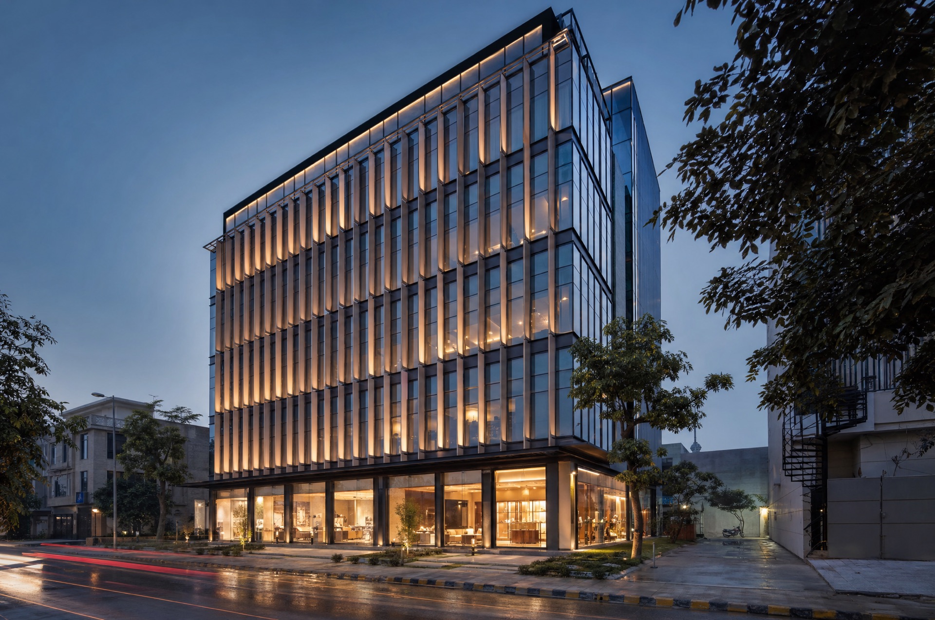 Modern commercial building with glass facade at blue hour